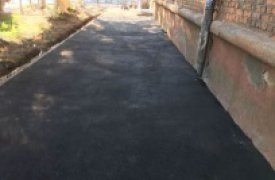 В Туле продолжают асфальтировать тротуары